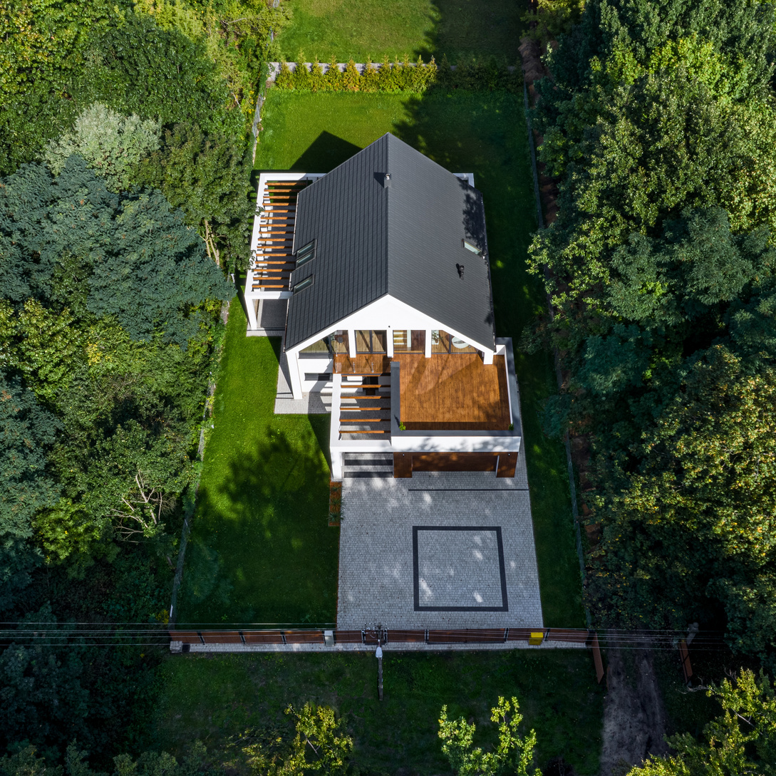 Drone view of house in forest
